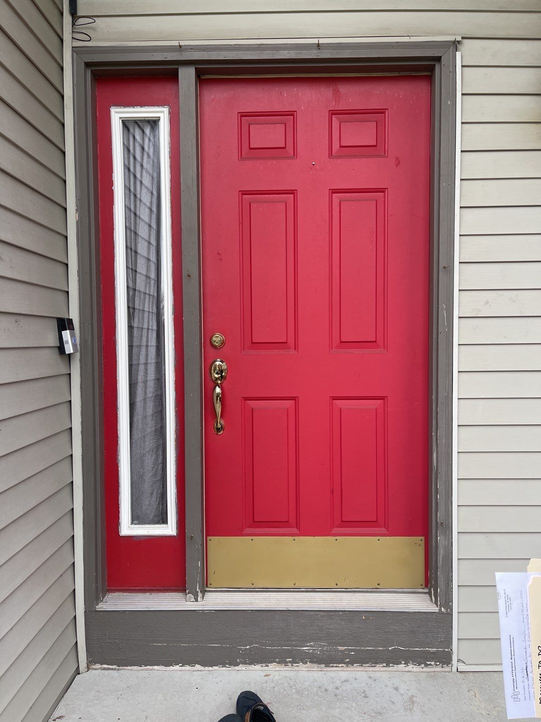 A bright red entry door in Granger, Indiana.