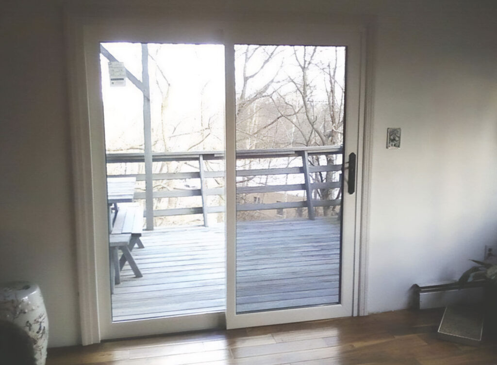 replacement sliding patio door overlooking a deck outside of home in granger indiana and the michiana bi-state area