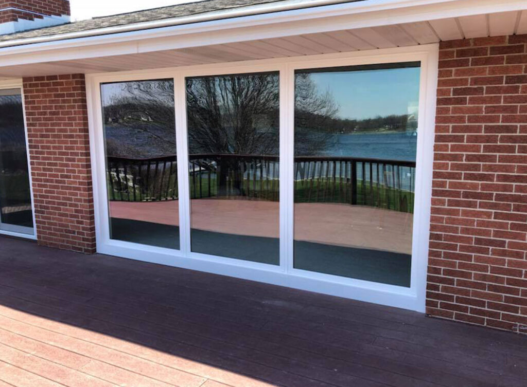 3 large picture windows side by side on brick home in granger indiana