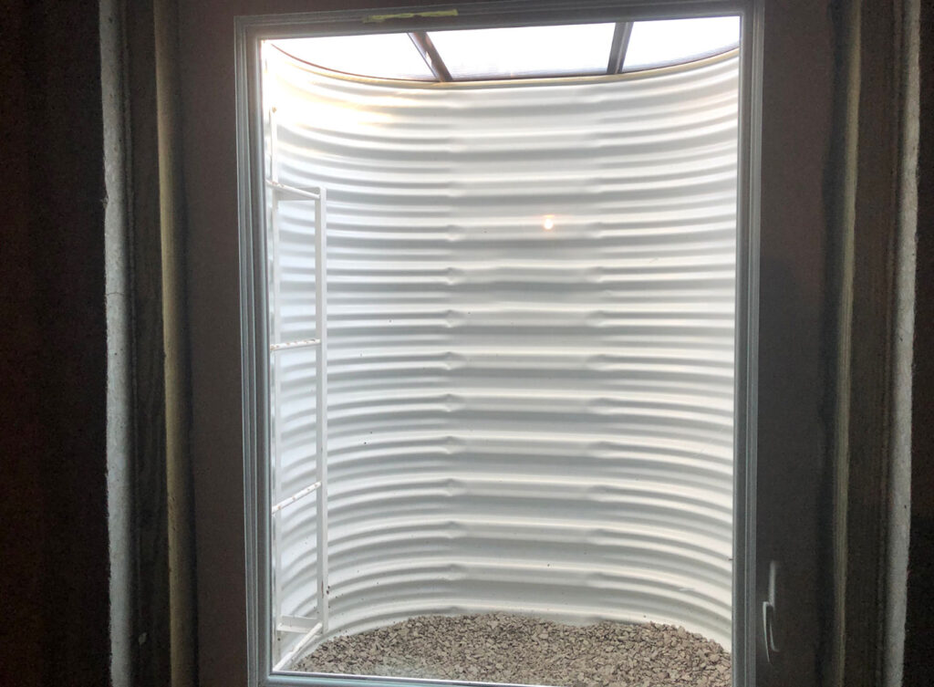 interior view of a window well inserted for a basement egress window granger indiana