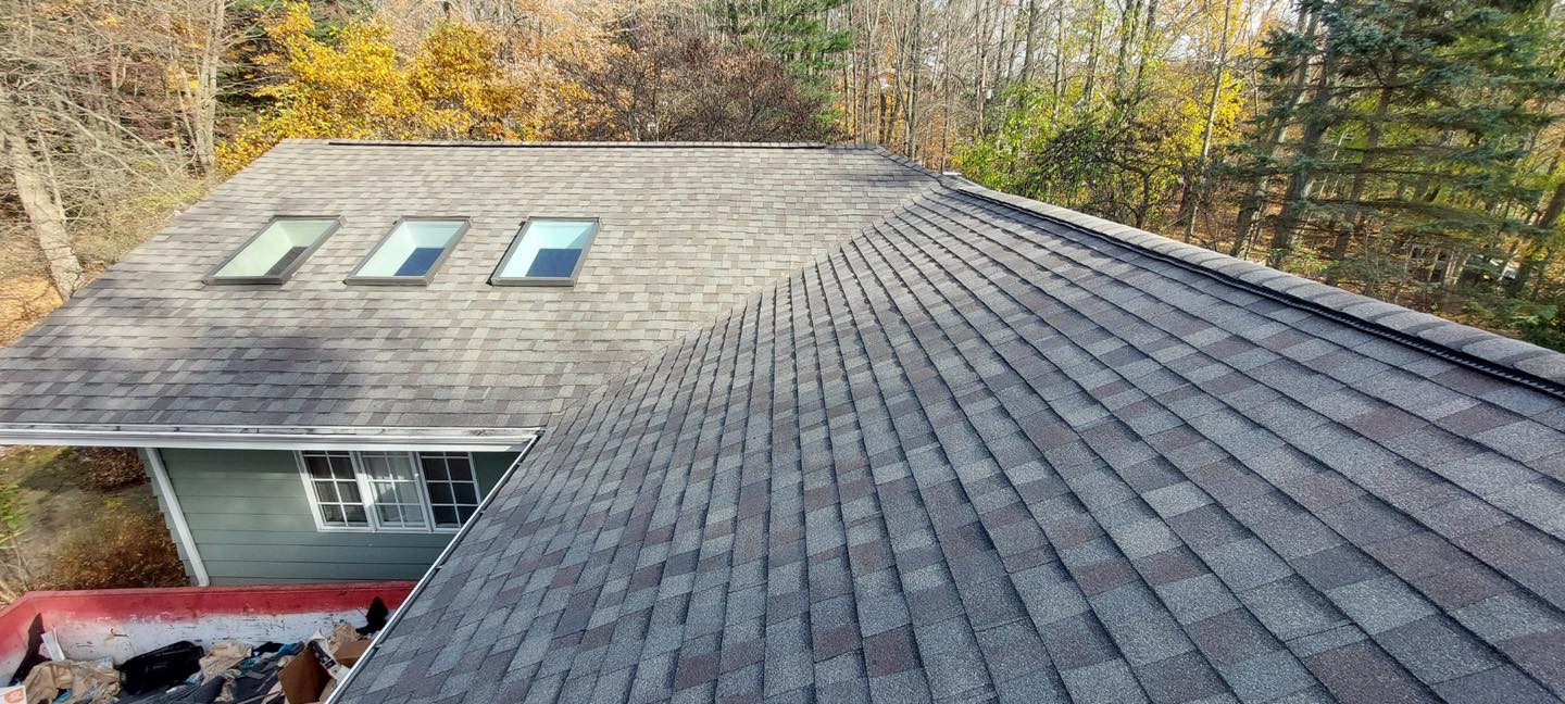 A brand new roof installed by a professional roofing contractor in Granger, IN. Brand new roof shingles and decking installed on a residential home.