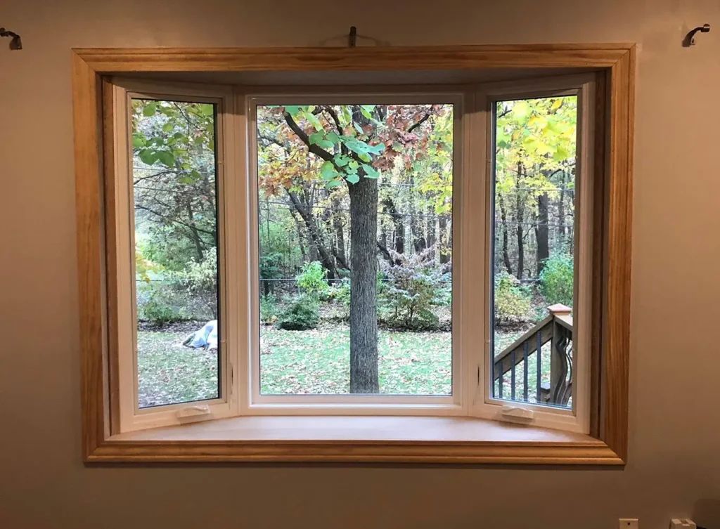 the view outside of newly-installed bay and bow windows near north webster, in