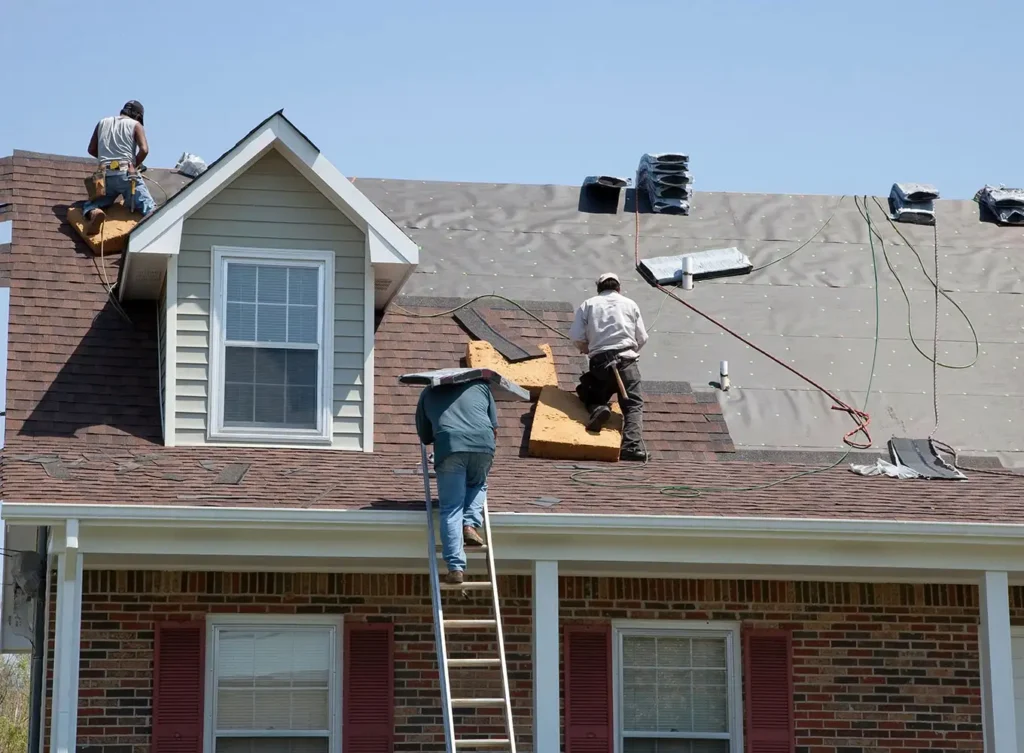 team of roofers replacing a roof in north webster, in
