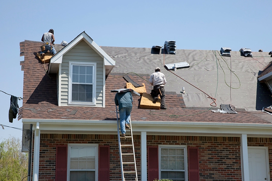 Professional workers replacing the roof of a home in Granger, IN.