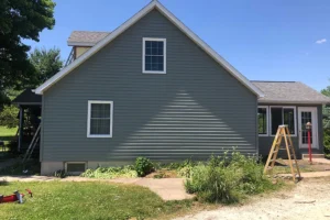 Home in Granger, IN with replaced gray, clean siding.