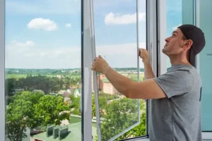 Energy Efficient Replacements—A technician installs a screen replacement at a residence in Granger, IN.